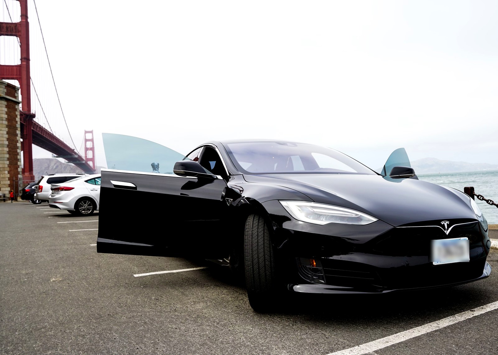 A car from the OnlyCars fleet parked by the Golden Gate Bridge in San Francisco